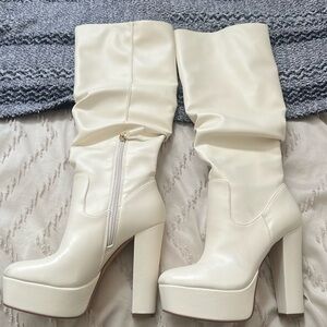 Jennifer Lopez white knee high boot